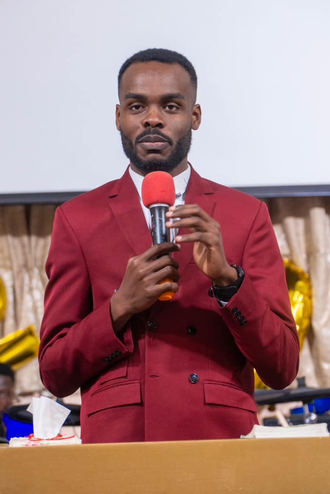 Samuel Kobina Gyasi speaking with an award displayed behind him